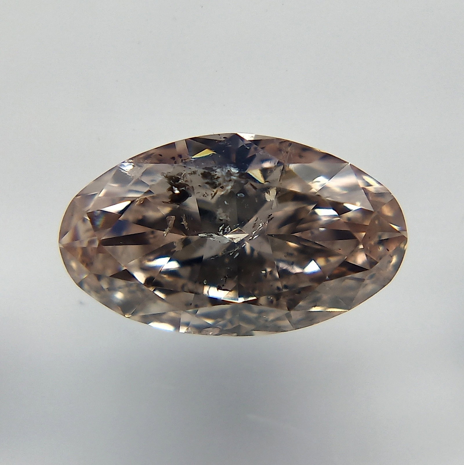Loose Diamond - OVAL 0.61ct Fancy Brownish Pink: Loose Diamond - OVAL 0.61ct Fancy Brownish Pink Source: Natural Shape: OVAL Carats: 0.61 Color: Fancy Brownish Pink Certification: GIA The Diamond Depot Guarantee: All items in this auction are guaran