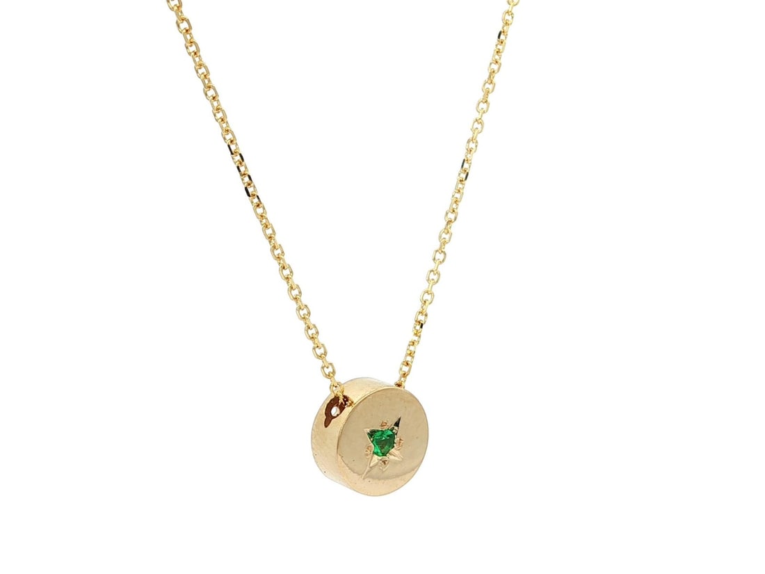 14k Yellow Gold Emerald Round Slide Pendant Necklace 0.05ct: 14k Yellow Gold Emerald Round Slide Pendant Necklace 0.05ct This exquisite necklace features a stunning round disk pendant crafted from solid 14k yellow gold and adorned with a natural emerald. The em