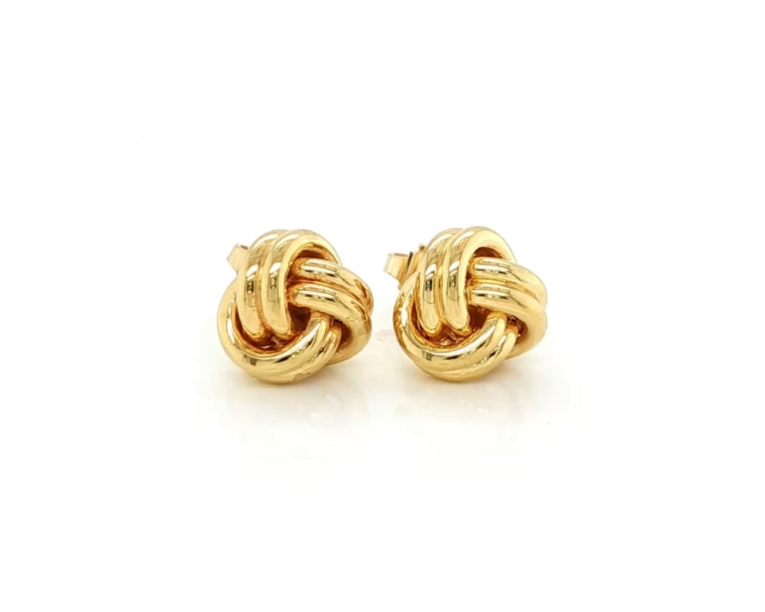 Tiffany & Co. Love Knot Stud Earrings in 18k Yellow Gold: Tiffany & Co. Love Knot Stud Earrings in 18k Yellow Gold Pre-owned Tiffany & Co. Love Knot stud earrings crafted in 18k yellow gold. This pair features the classic sculptural Love Knot motif in a poli