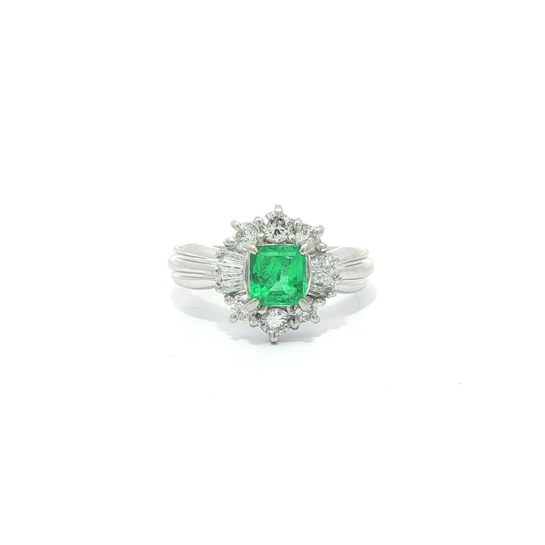 Platinum Cocktail Ring with Square Emerald and White Diamonds 1.07ct Vintage: Platinum Cocktail Ring with Square Emerald and White Diamonds 1.07ct Vintage This vintage cocktail ring features a vivid green square emerald at its center, weighing 0.54ct and sourced from Colombia. 