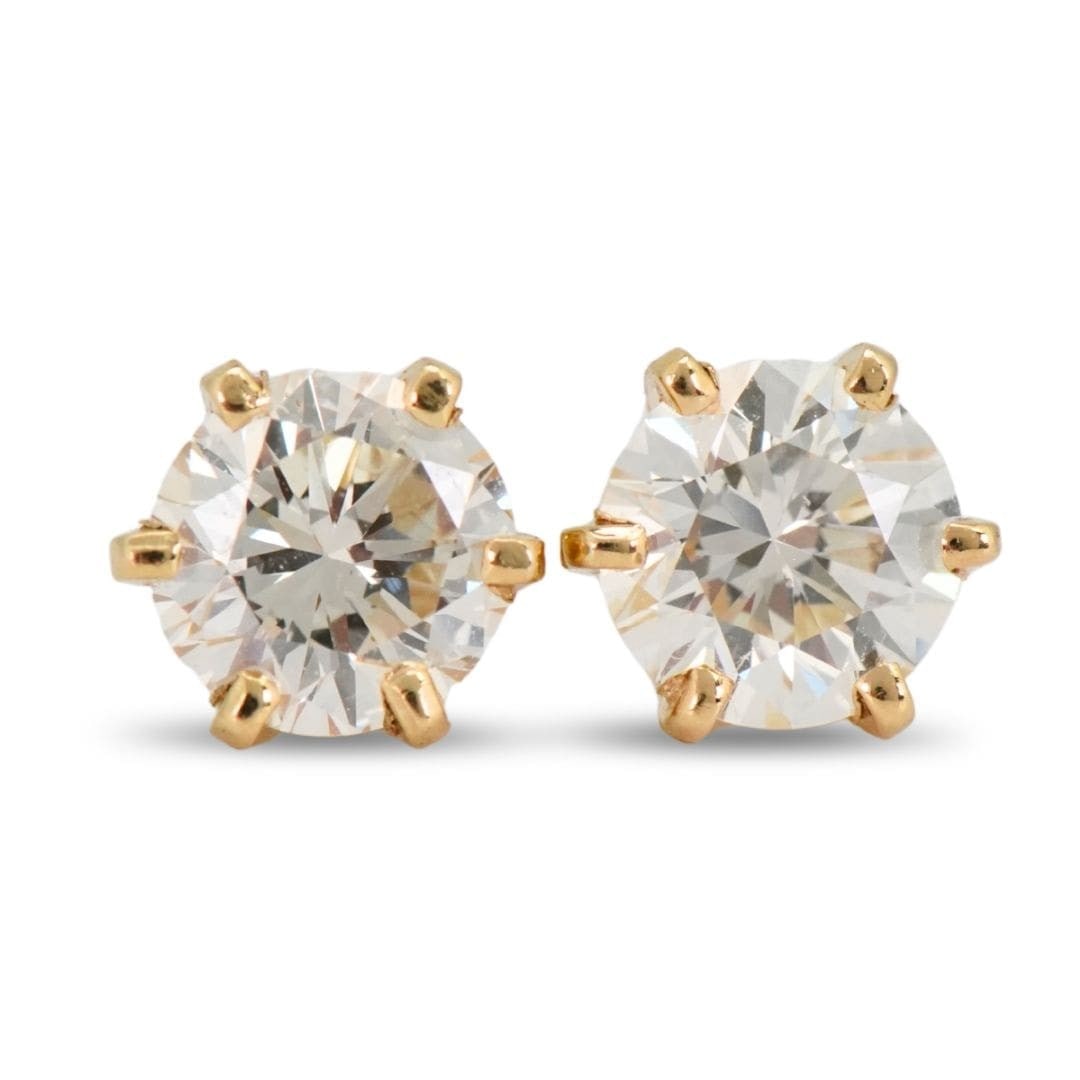 Round Diamond Stud Earrings in 14K Yellow Gold: Round Diamond Stud Earrings in 14K Yellow Gold These elegant stud earrings feature round brilliant cut natural diamonds totaling 1.00 carat, set in 14K yellow gold. The diamonds are graded H-I in colo