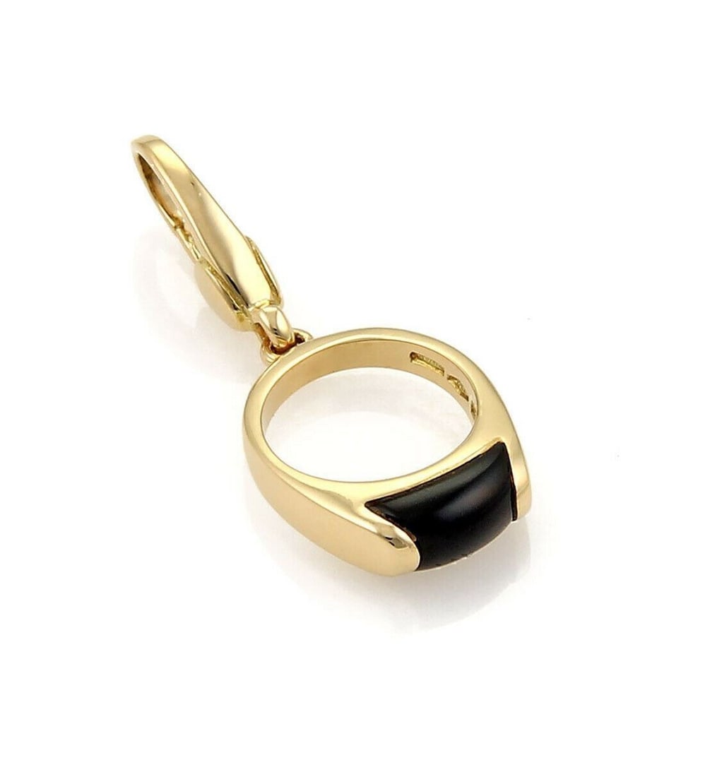 Bvlgari Tronchetto 18k Yellow Gold Onyx Mini Ring Charm Pendant: Bvlgari Tronchetto 18k Yellow Gold Onyx Mini Ring Charm Pendant Bvlgari Tronchetto mini ring charm pendant in 18k yellow gold, centered with natural black onyx. This signed fine jewelry piece from Ita