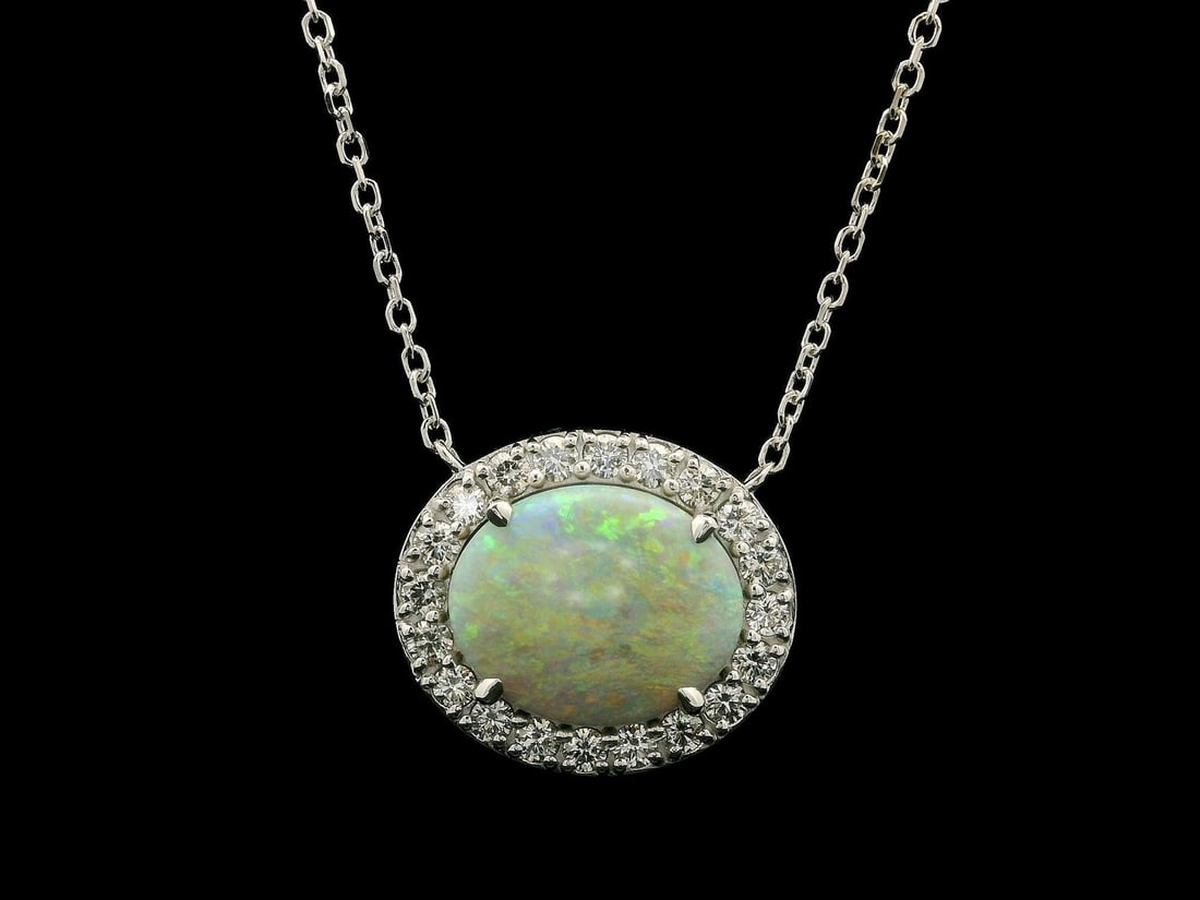 New 14k White Gold GIA Certified 6.83ct Opal Diamond Halo Pendant Necklace: New 14k White Gold GIA Certified 6.83ct Opal Diamond Halo Pendant Necklace This stunning pendant necklace features a beautiful natural genuine opal, oval cabochon cut, weighing 5.95 carats, prong set 
