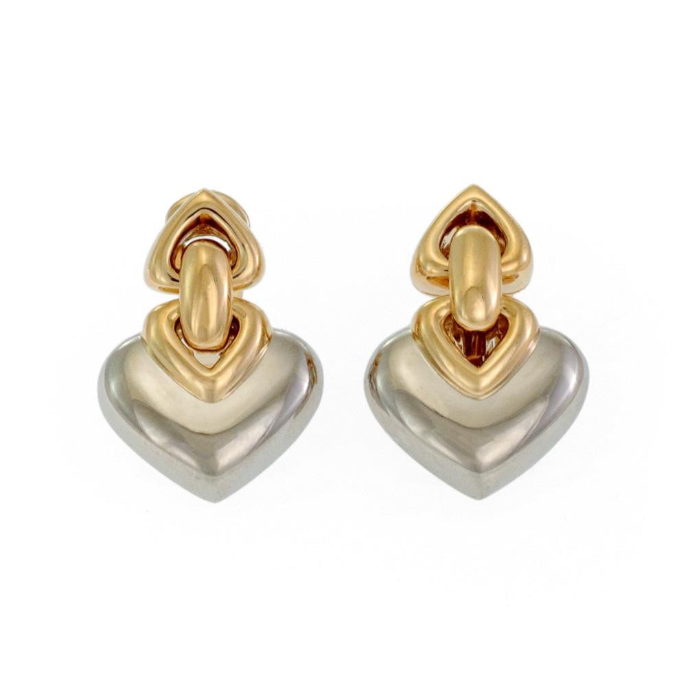Bvlgari Double Hearts 18k Gold Stainless Steel Earrings: Bvlgari Double Hearts 18k Gold Stainless Steel Earrings Elevate your accessory collection with these exquisite Bvlgari earrings, expertly crafted from 18k yellow gold and stainless steel. The design f