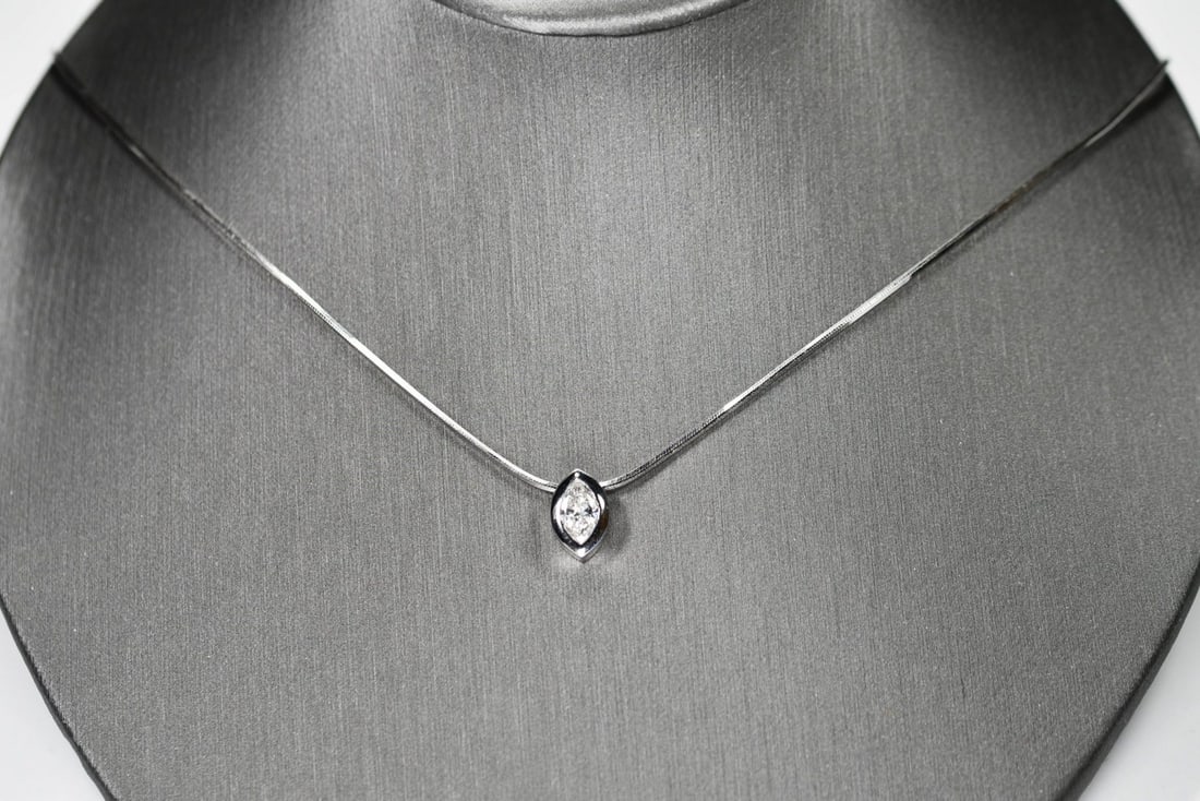 Marquise Diamond 14K White Gold Pendant Necklace 17 in: Marquise Diamond 14K White Gold Pendant Necklace 17 in This elegant necklace features a sliding marquise-shaped diamond pendant set in a 14k white gold bezel setting. The pendant showcases a single ma