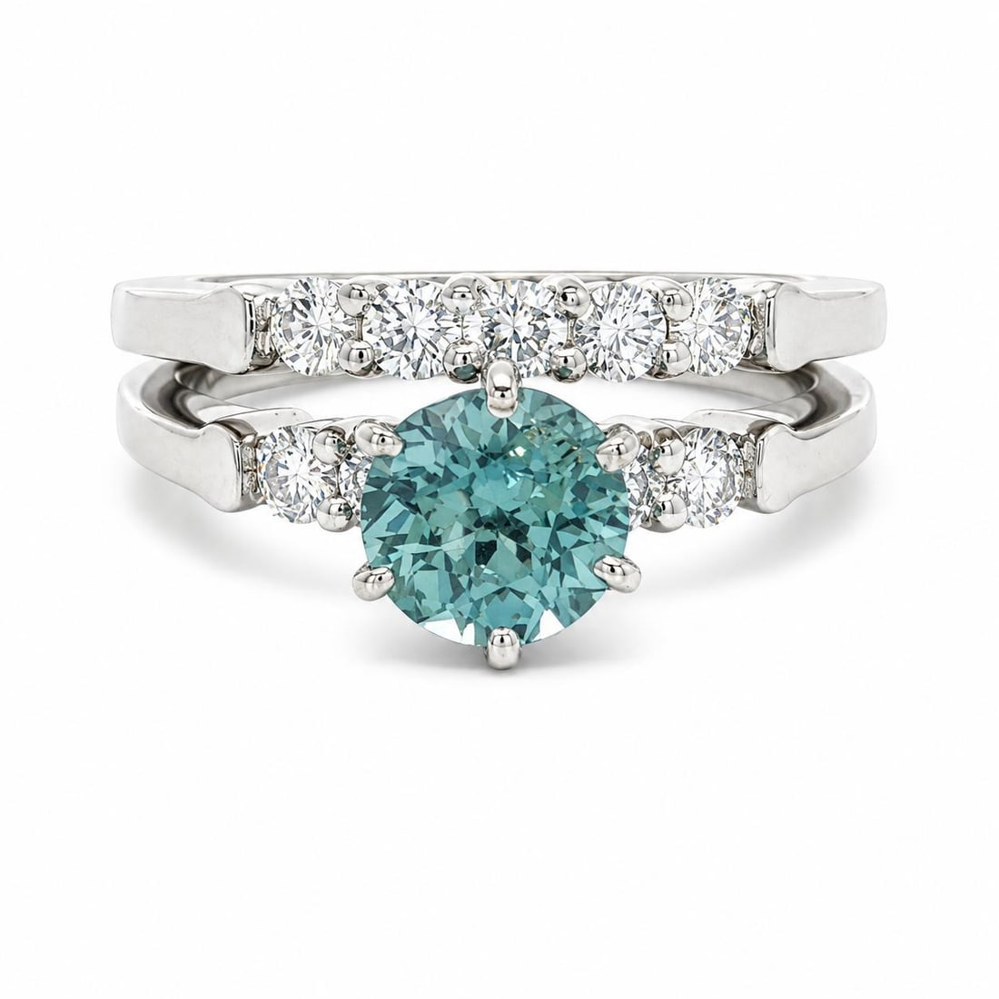 Platinum Bridal Ring Set with GIA Montana Sapphire and Diamonds 1.77ctw: Platinum Bridal Ring Set with GIA Montana Sapphire and Diamonds 1.77ctw This platinum engagement and wedding band ring set features one natural Montana sapphire and nine natural diamonds. The sapphire