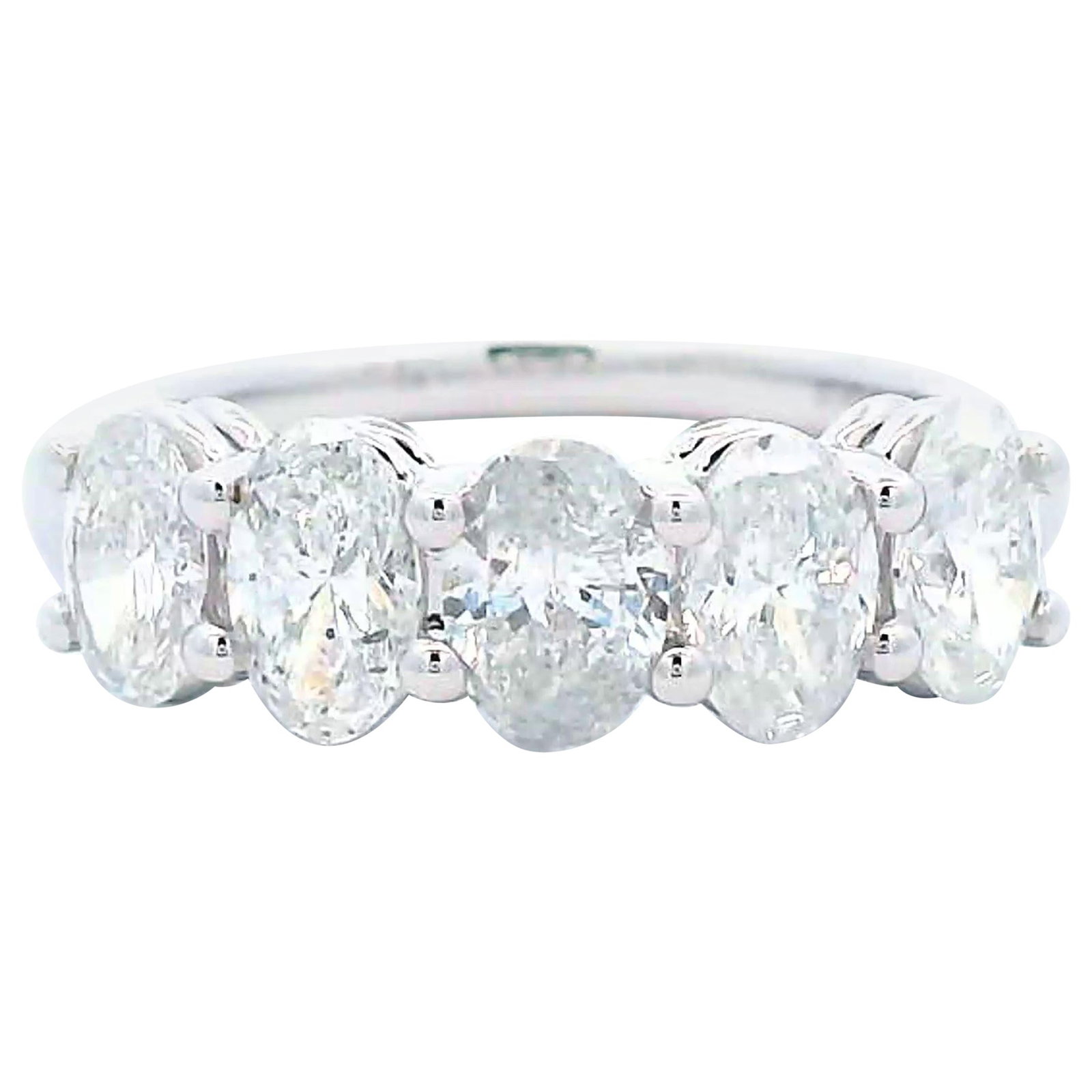 1.48ct Oval Diamond Half Eternity Band 18k White Gold: 1.48ct Oval Diamond Half Eternity Band 18k White Gold This exquisite half eternity band showcases five stunning oval cut diamonds totaling 1.48 carats, featuring F/G color and SI clarity. The ring is 