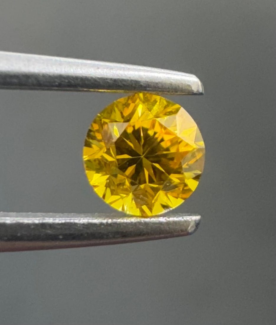 Loose Diamond - ROUND 0.25ct Fancy Vivid Orangey Yellow SI1: Loose Diamond - ROUND 0.25ct Fancy Vivid Orangey Yellow SI1 Source: Natural Shape: ROUND Carats: 0.25 Color: Fancy Vivid Orangey Yellow Certification: GIA The Diamond Depot Guarantee: All items in thi