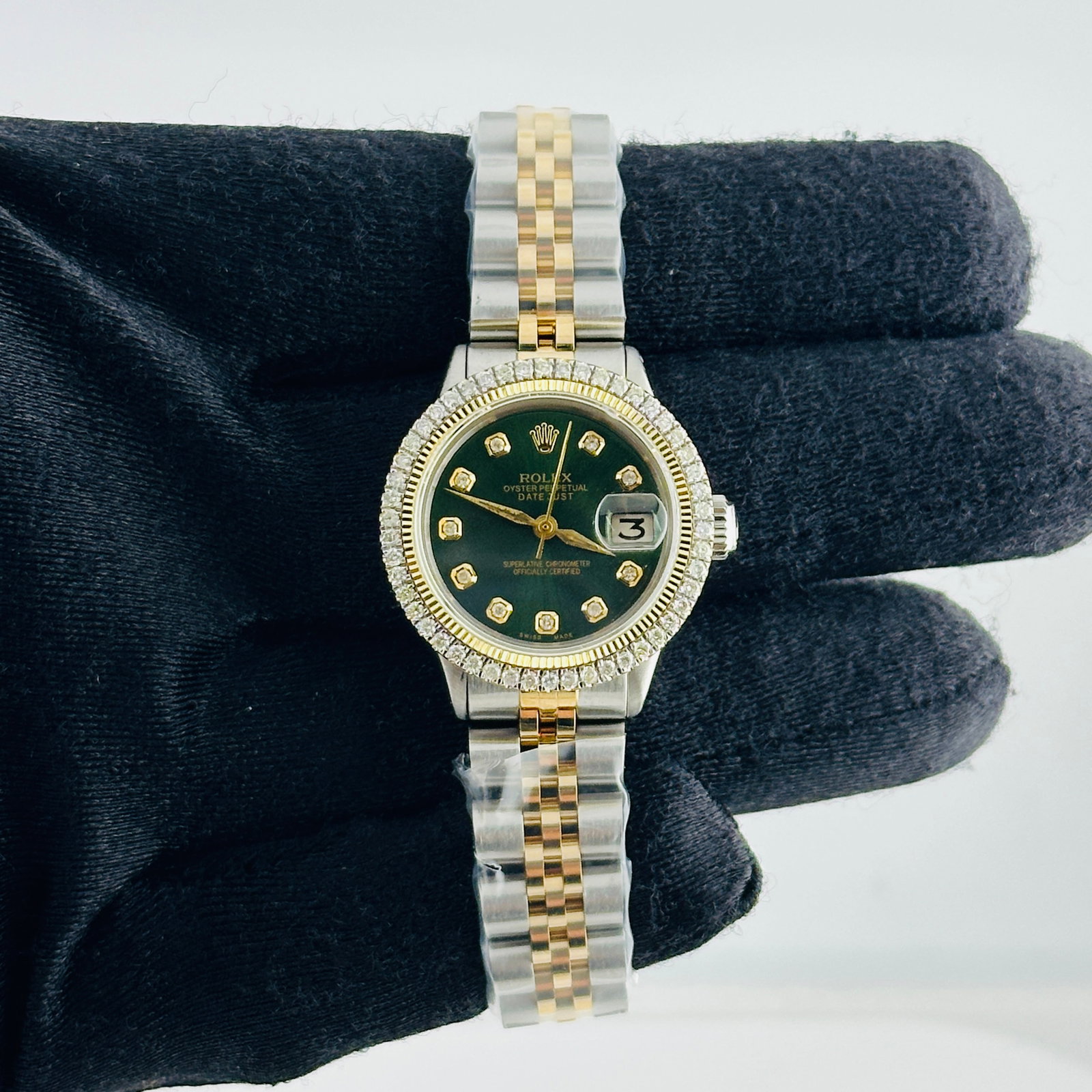 Ladies Rolex Datejust 6517 Green Yellow Diamond Dial Jubilee Bracelet: Ladies Rolex Datejust 6517 Green Yellow Diamond Dial Jubilee Bracelet This ladies' Rolex Datejust features an aftermarket green dial with yellow diamond markers, set within a prong yellow gold plated 