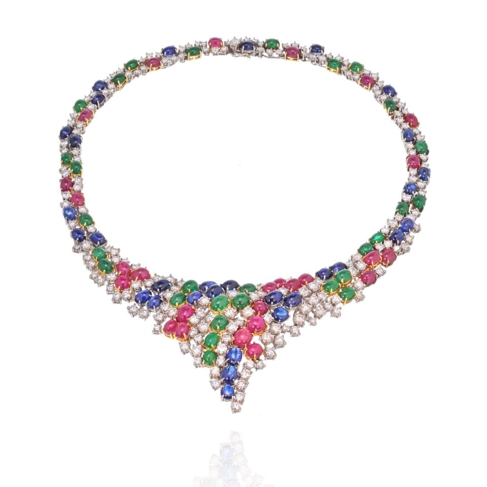 Stunning 18K Two Tone Necklace with 38 Carats of Diamonds Rubies Sapphires: Stunning 18K Two Tone Necklace with 38 Carats of Diamonds Rubies Sapphires This exquisite 18K two-tone gold necklace features a stunning array of gemstones totaling 38 carats, including vibrant rubies