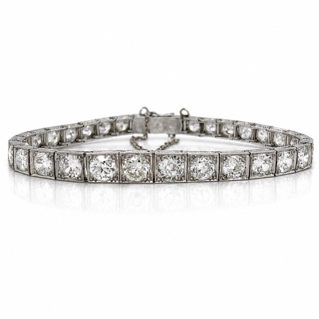 Platinum Art Deco Diamond Bracelet 12.00 Ct 7 Inch: Platinum Art Deco Diamond Bracelet 12.00 Ct 7 Inch Art Deco platinum bracelet featuring a graduated diamond design. It is set with 32 European-cut diamonds with an approximate total weight of 12.00 ct