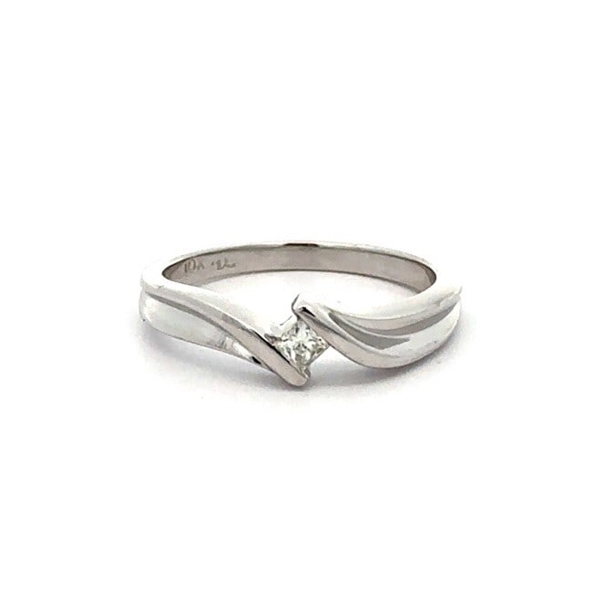 10K White Gold Channel Set Diamond Engagement Ring 0.10ct: 10K White Gold Channel Set Diamond Engagement Ring 0.10ct This stunning engagement promise ring features a channel-set diamond in a sleek and elegant design. Crafted from solid 10K white gold, this ri