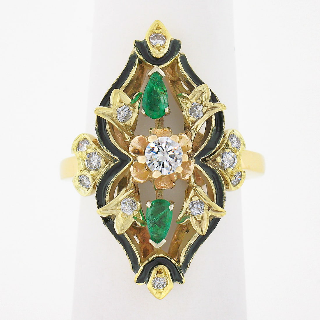 Elongated Cocktail Ring 14k Yellow Gold Diamonds Emeralds Black Enamel: Elongated Cocktail Ring 14k Yellow Gold Diamonds Emeralds Black Enamel Vintage elongated cocktail ring crafted in solid 14k yellow gold with black enamel detailing and an openwork floral design. It is