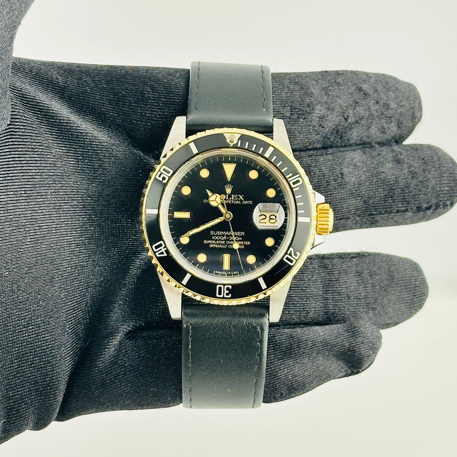 Rolex 16803 Submariner Mens Watch Black Dial Leather Strap: Rolex 16803 Submariner Mens Watch Black Dial Leather Strap Rolex Submariner wristwatch featuring a black dial, rotating aluminum bezel, and a generic leather band. This men's watch is identified by re