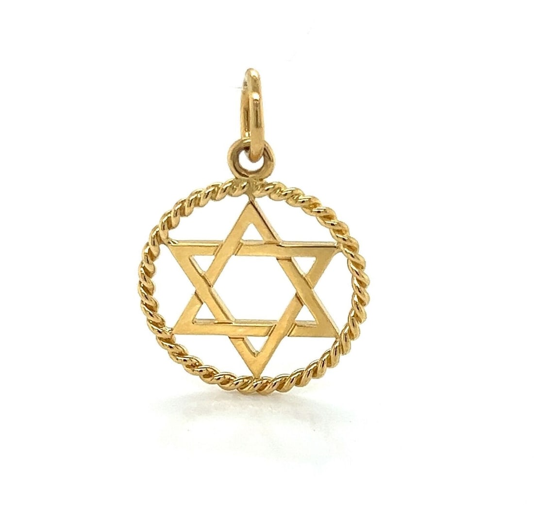 Tiffany & Co. 18k Yellow Gold Star of David Charm Pendant: Tiffany & Co. 18k Yellow Gold Star of David Charm Pendant Pre-owned Tiffany & Co. Star of David charm pendant in 18k yellow gold with a polished round design and no stone. This signed pendant features