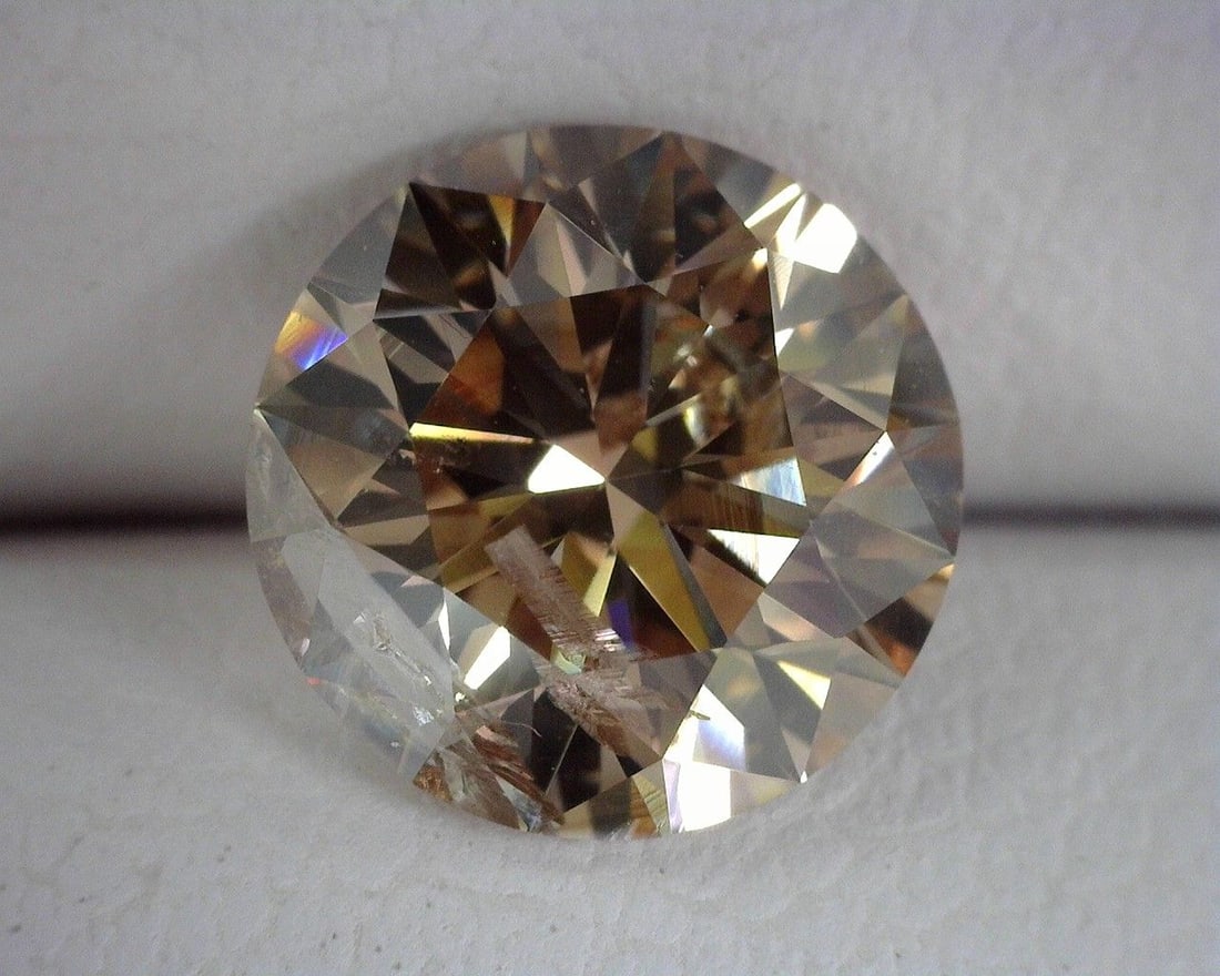 Loose Diamond - ROUND 1.43ct Brown I1: Loose Diamond - ROUND 1.43ct Brown I1 Source: Natural Shape: ROUND Carats: 1.43 Color: Brown Certification: OTHER The Diamond Depot Guarantee: All items in this auction are guaranteed to be 100% authe