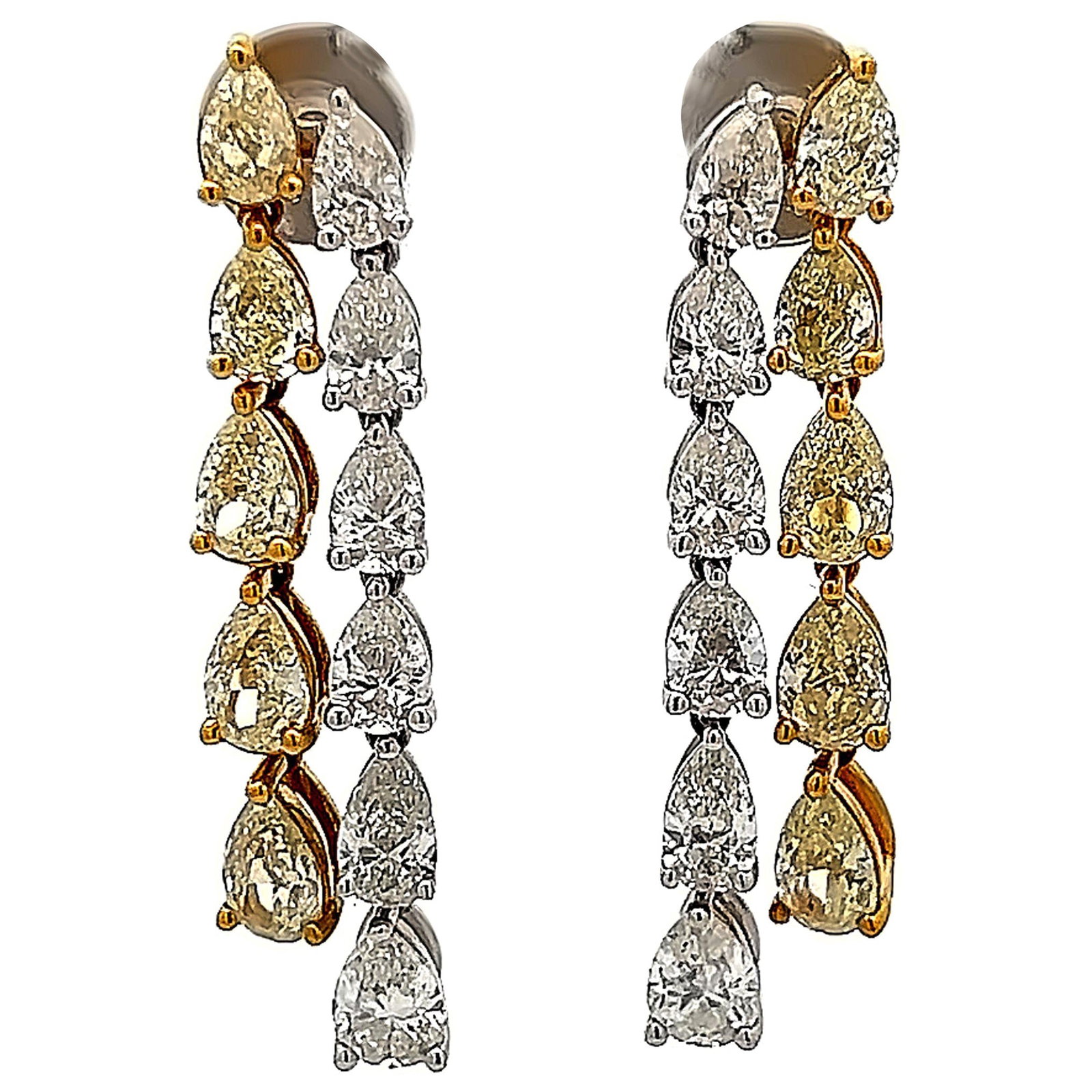 7.34ct Fancy Yellow White Diamond Drop Earrings 18k Gold: 7.34ct Fancy Yellow White Diamond Drop Earrings 18k Gold These stunning drop earrings feature a remarkable combination of fancy yellow and white diamonds, totaling 7.34 carats. Crafted from luxurious 