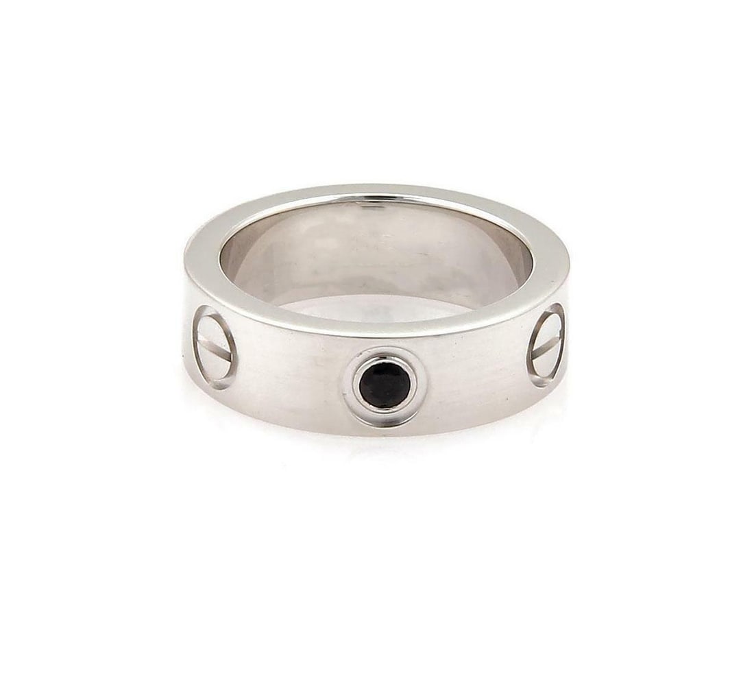 Cartier Love 1 Black Diamond 18k White Gold Band Ring Size 49 US 5: Cartier Love 1 Black Diamond 18k White Gold Band Ring Size 49 US 5 This exquisite band ring from Cartier's Love collection is elegantly crafted in 18k white gold and features a striking single round c