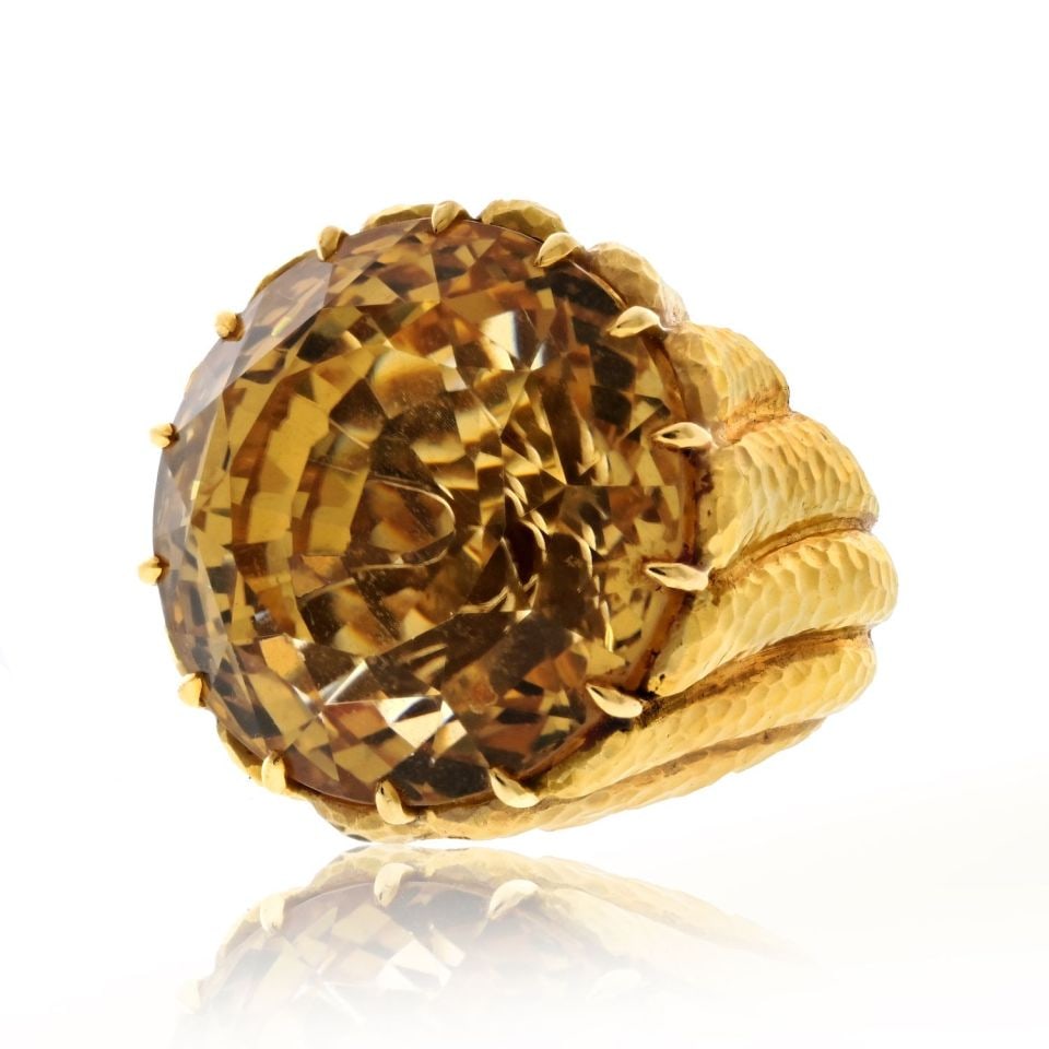 David Webb Platinum 18K Gold Citrine Cocktail Ring Estate Piece: David Webb Platinum 18K Gold Citrine Cocktail Ring Estate Piece This stunning cocktail ring from David Webb showcases a beautiful 24mm wide citrine gemstone, surrounded by a luxurious blend of platinu