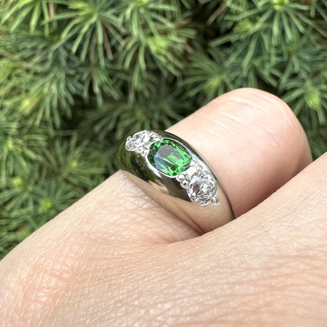 Vintage 13-14k White Gold Tsavorite Garnet Ring with Old Cut Diamond Accents: Vintage 13-14k White Gold Tsavorite Garnet Ring with Old Cut Diamond Accents Vintage domed band ring featuring an oval natural tsavorite garnet accented by two old European cut diamonds. Crafted in so