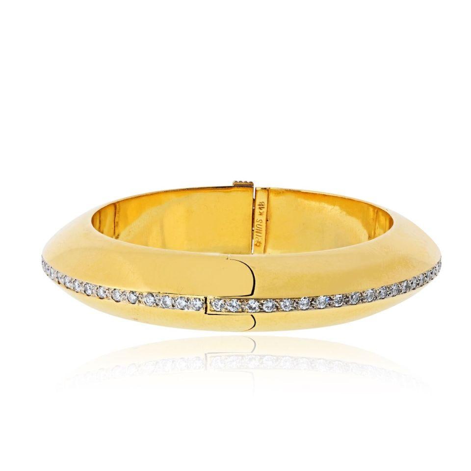 18K Yellow Gold Diamond Donut Style Hinged Bangle Bracelet: 18K Yellow Gold Diamond Donut Style Hinged Bangle Bracelet This 18K yellow gold bangle bracelet is designed in a distinctive "donut" style and set with approximately 2.34 carats of round brilliant cut