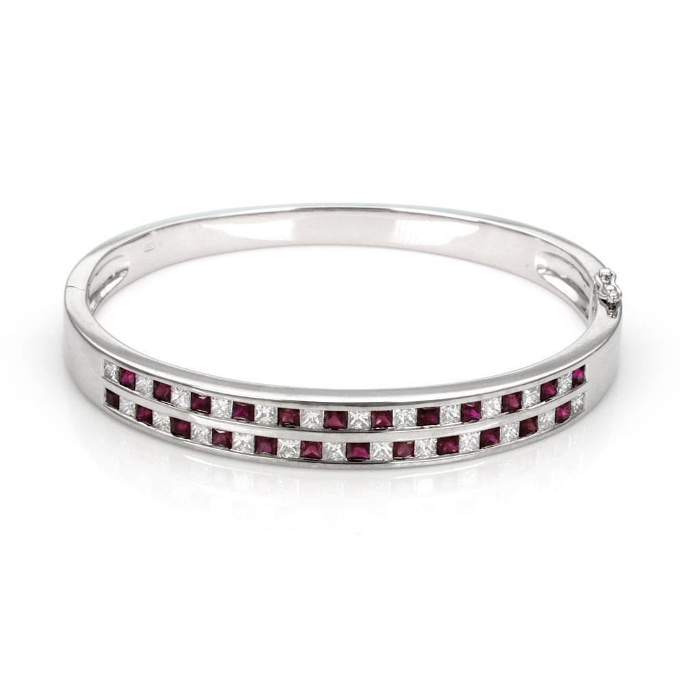 Elegant 18k White Gold Bangle Bracelet with 5 Carats Diamonds and Rubies: Elegant 18k White Gold Bangle Bracelet with 5 Carats Diamonds and Rubies This exquisite Estate bangle bracelet is crafted from luxurious 18k white gold, showcasing a polished finish. The bracelet feat