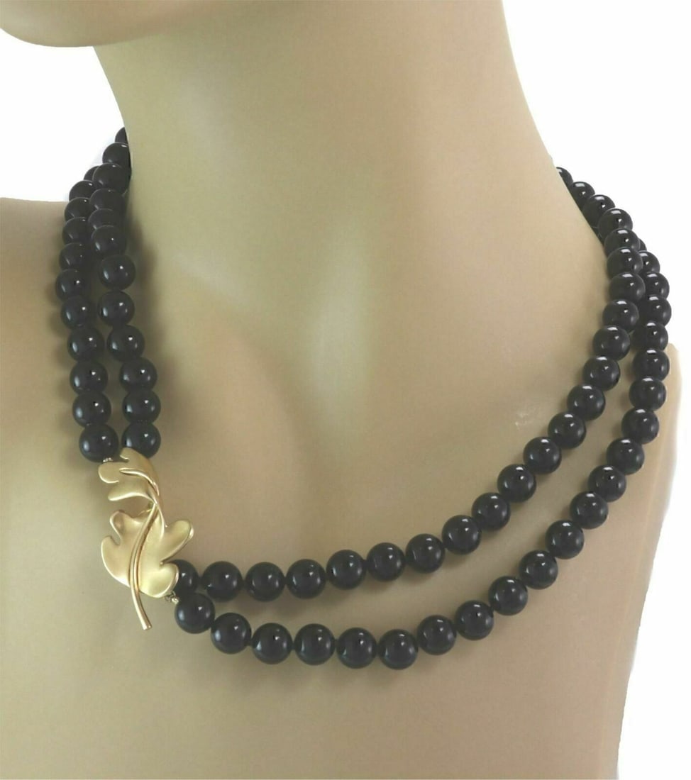 Tiffany & Co. Oak Leaf Enhancer Necklace in 18k Gold with Onyx Beads: Tiffany & Co. Oak Leaf Enhancer Necklace in 18k Gold with Onyx Beads Vintage Tiffany & Co. necklace featuring polished natural black onyx beads and an oak leaf enhancer in 18k yellow gold. This origin