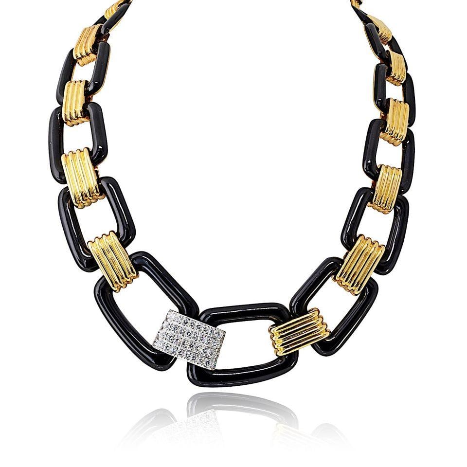 David Webb 18K Yellow Gold Enamel Link Necklace with Diamond Station: David Webb 18K Yellow Gold Enamel Link Necklace with Diamond Station This David Webb necklace features oversized black enamel links connected by sculptural ribbed stations crafted in 18K yellow gold. 