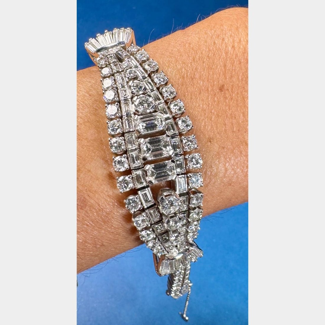 Art Deco Platinum Diamond Bracelet 15.70 Ct D-F Color VVS-VS Clarity: Art Deco Platinum Diamond Bracelet 15.70 Ct D-F Color VVS-VS Clarity This exquisite Art Deco bracelet is crafted in platinum and features a total diamond weight of 15.70 carats. It showcases 77 baguet