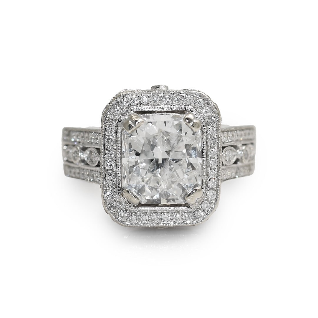 EGL Certified 14K White Gold Radiant Diamond Ring Size 6: EGL Certified 14K White Gold Radiant Diamond Ring Size 6 This 14K white gold ring features a 3.63 carat radiant cut diamond as the center stone, graded F color and I1 clarity by EGL. The center diamon
