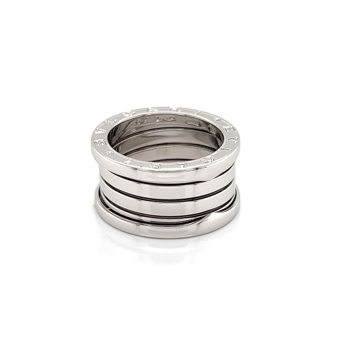 Bvlgari B.zero1 18k White Gold Four Band Ring Size 6 with Certificate: Bvlgari B.zero1 18k White Gold Four Band Ring Size 6 with Certificate Pre-owned Bvlgari B.zero1 four-band ring crafted in 18k white gold. This signed band features the collection's iconic spiral-inspi