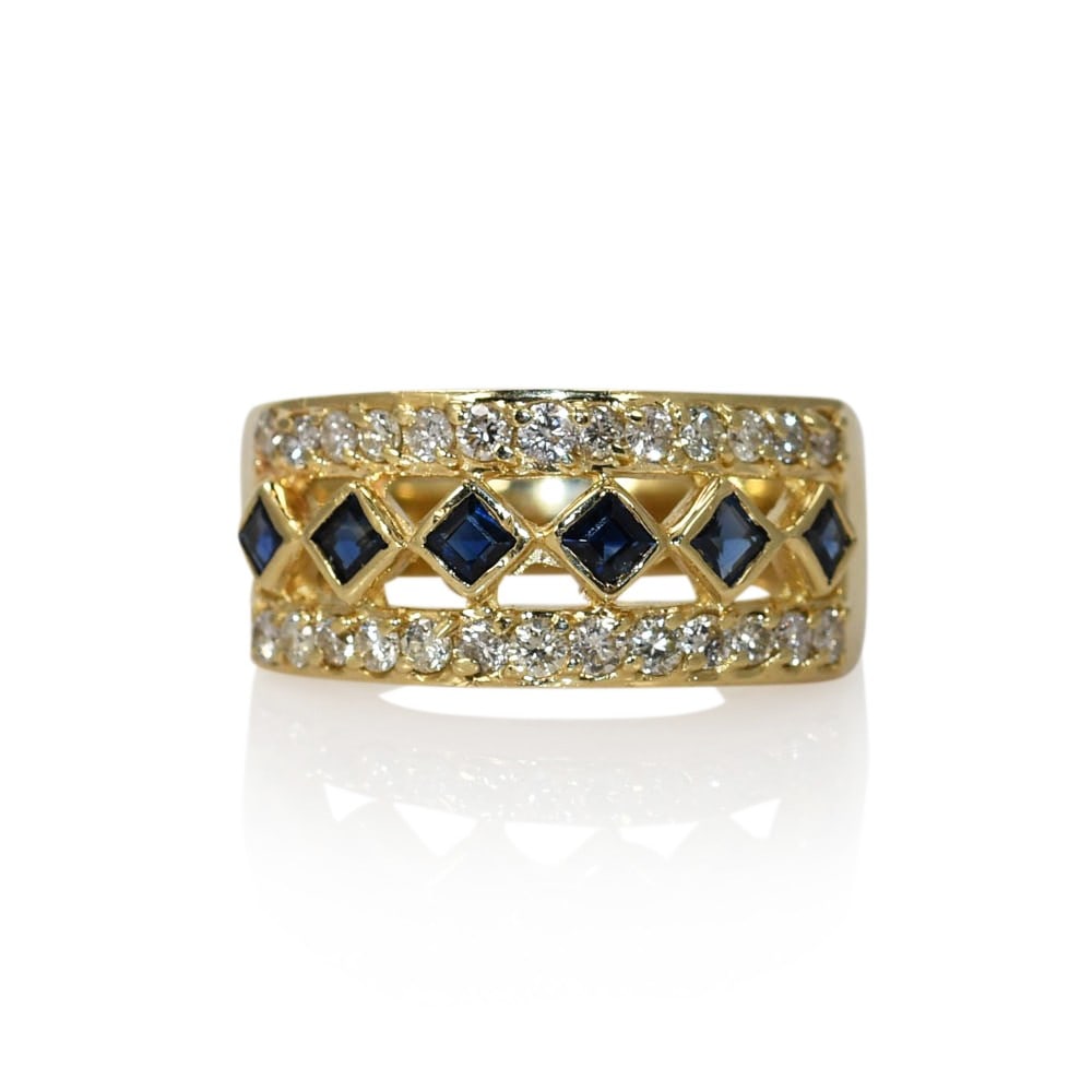 Sapphire and Diamond 14K Yellow Gold Band Ring 7.25: Sapphire and Diamond 14K Yellow Gold Band Ring 7.25 Pre-owned ladies band ring crafted in 14k yellow gold, featuring a row of dark blue natural sapphires accented by round brilliant cut diamonds. This
