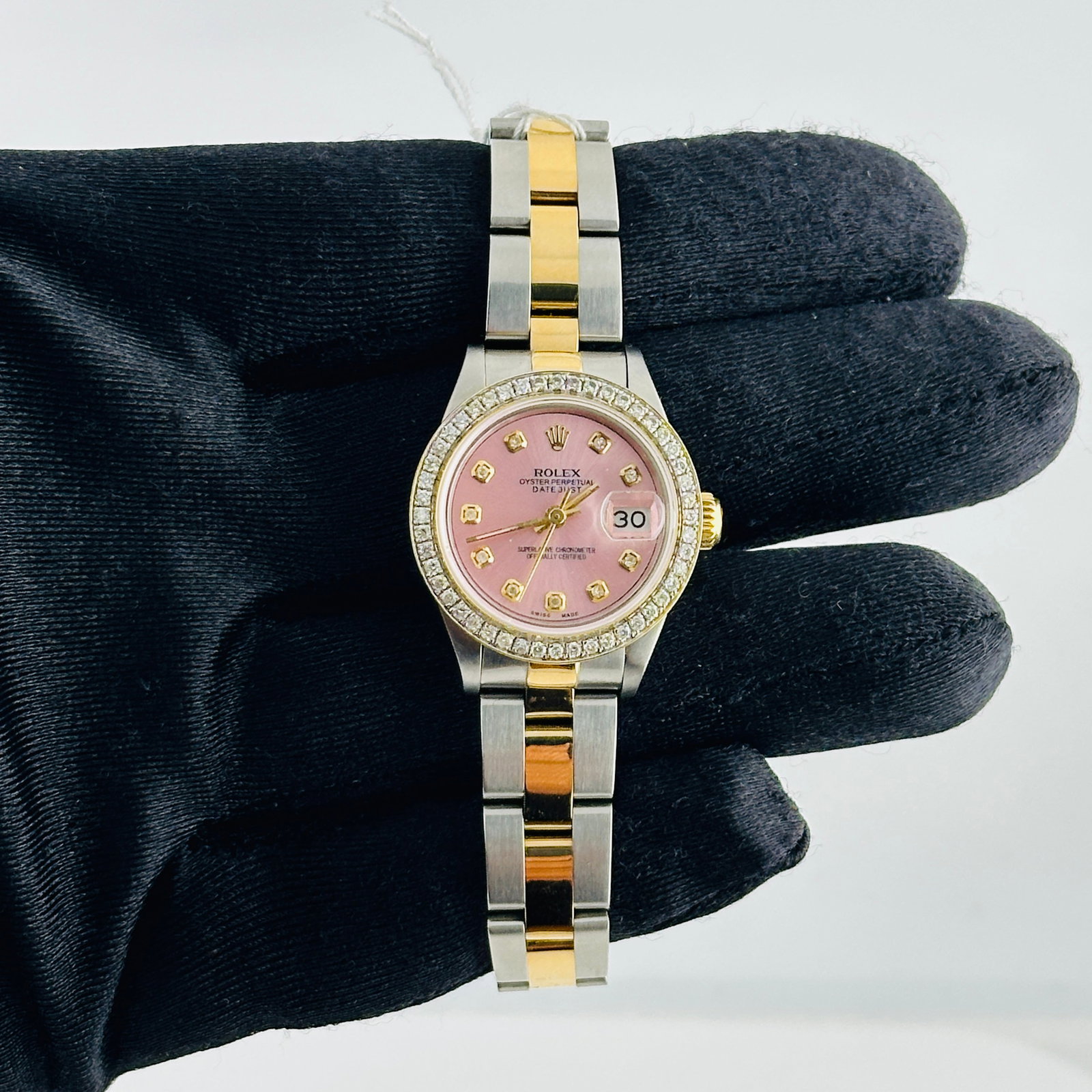 Ladies Rolex Datejust 69163 Oyster Bracelet Pave 10K Diamond Bezel: Ladies Rolex Datejust 69163 Oyster Bracelet Pave 10K Diamond Bezel This Rolex Datejust is designed for ladies and features an after-market white mother-of-pearl diamond dial. The watch includes a pave