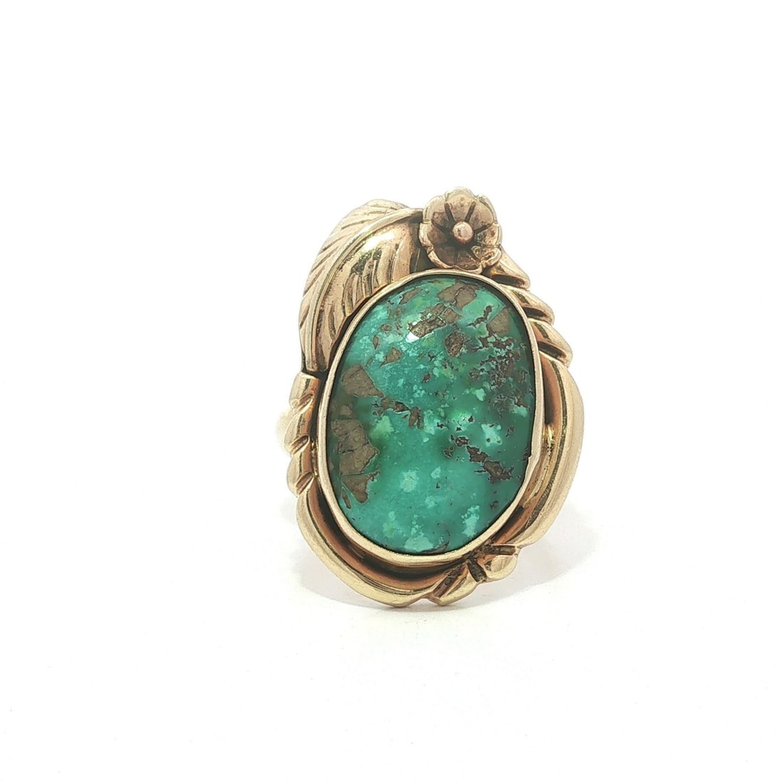 Navajo 14k Yellow Gold Cocktail Ring with Matrix Turquoise: Navajo 14k Yellow Gold Cocktail Ring with Matrix Turquoise Vintage handmade Navajo cocktail ring featuring a natural genuine matrix turquoise cabochon in a floral leaf design. Crafted in solid 14k yel