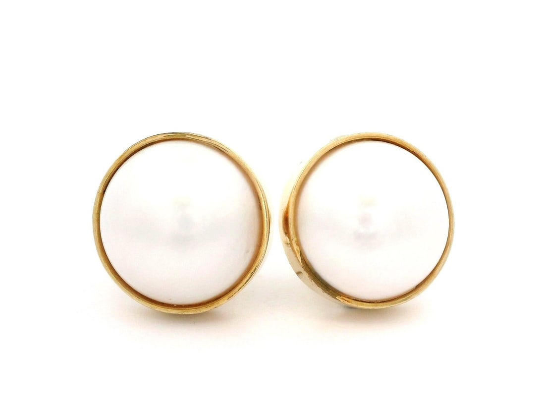 14k Solid Yellow Gold Mabe Pearl Clip On Earrings 14.7mm: 14k Solid Yellow Gold Mabe Pearl Clip On Earrings 14.7mm These exquisite Solid Yellow Gold Clip On Earrings feature two genuine cultured Mabe pearls, each approximately 14.7mm in diameter. The pearls 