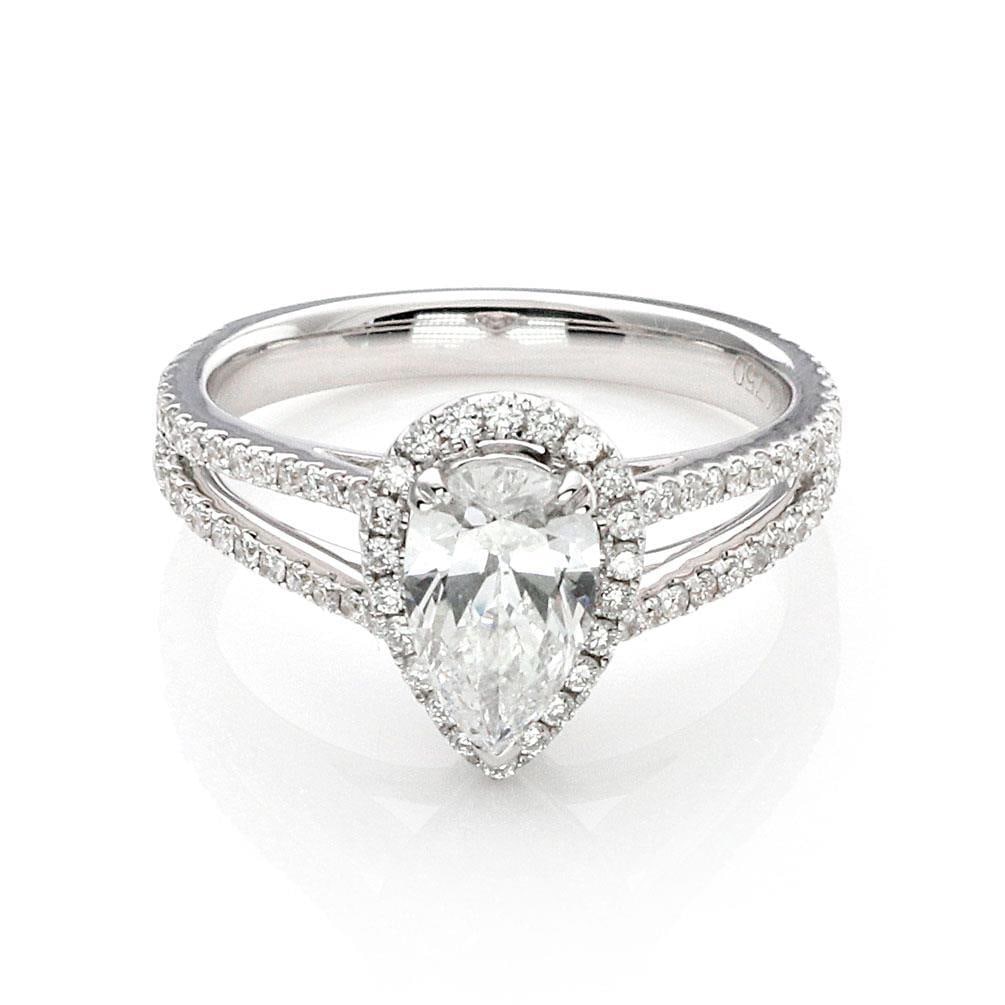1.00ct Pear Cut D SI2 Diamond Halo Ring 18k White Gold GIA Certified: 1.00ct Pear Cut D SI2 Diamond Halo Ring 18k White Gold GIA Certified This stunning pear cut diamond engagement ring features a captivating 1.00 carat center diamond with a color grade of D and clarity