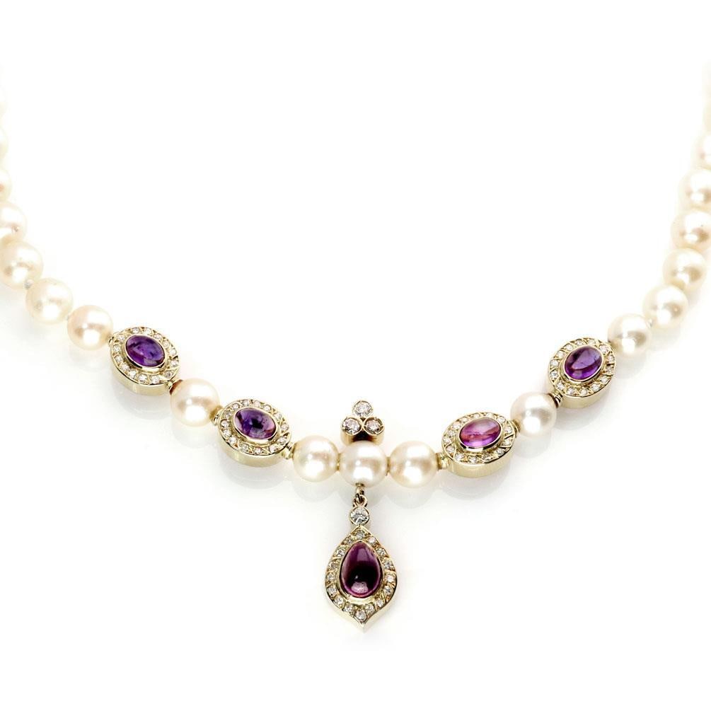 18k Yellow Gold Cultured Pearl Necklace with Diamond and Amethyst Accents: 18k Yellow Gold Cultured Pearl Necklace with Diamond and Amethyst Accents Estate necklace crafted in 18k yellow gold with a single strand of cultured pearls and an ornate centerpiece. The design featu