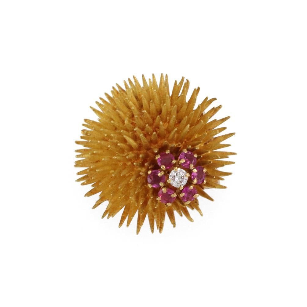 Tiffany & Co. Vintage 18k Gold Ruby Diamond Sea Urchin Brooch: Tiffany & Co. Vintage 18k Gold Ruby Diamond Sea Urchin Brooch This exquisite vintage brooch from Tiffany & Co. showcases a unique design featuring an intricately crafted sea urchin with a delicate flo