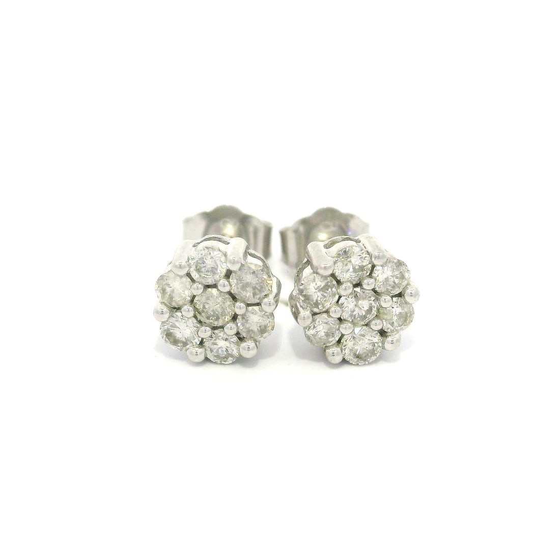 10k White Gold 0.50ctw Diamond Flower Cluster Stud Earrings: 10k White Gold 0.50ctw Diamond Flower Cluster Stud Earrings These stunning petite flower cluster stud earrings are crafted from solid 10k white gold, featuring a total of 14 natural genuine diamonds. 