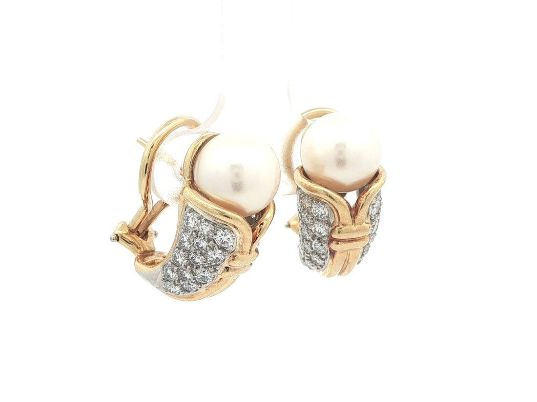 Pearl and Diamond Stud Earrings in 18k Yellow Gold with Platinum Accents: Pearl and Diamond Stud Earrings in 18k Yellow Gold with Platinum Accents These vintage stud earrings feature a sophisticated tulip design crafted in solid 18k yellow gold with platinum accents. Each e