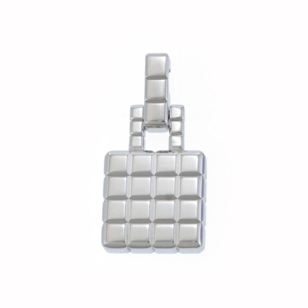 Chopard 18k White Gold Cube Pendant with Hallmarks: Chopard 18k White Gold Cube Pendant with Hallmarks This exquisite Chopard pendant showcases a unique design, crafted from 18k white gold with a polished finish. The pendant features a chic square shap