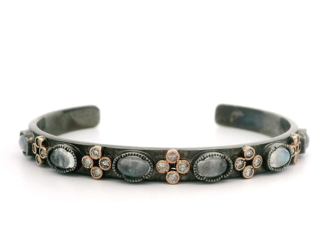 John Apel 14k Rose Gold Moonstone Diamond Cuff Bracelet: John Apel 14k Rose Gold Moonstone Diamond Cuff Bracelet This stunning open cuff bracelet features a beautiful combination of sterling silver and 14k rose gold accents, designed by John Apel. The brace