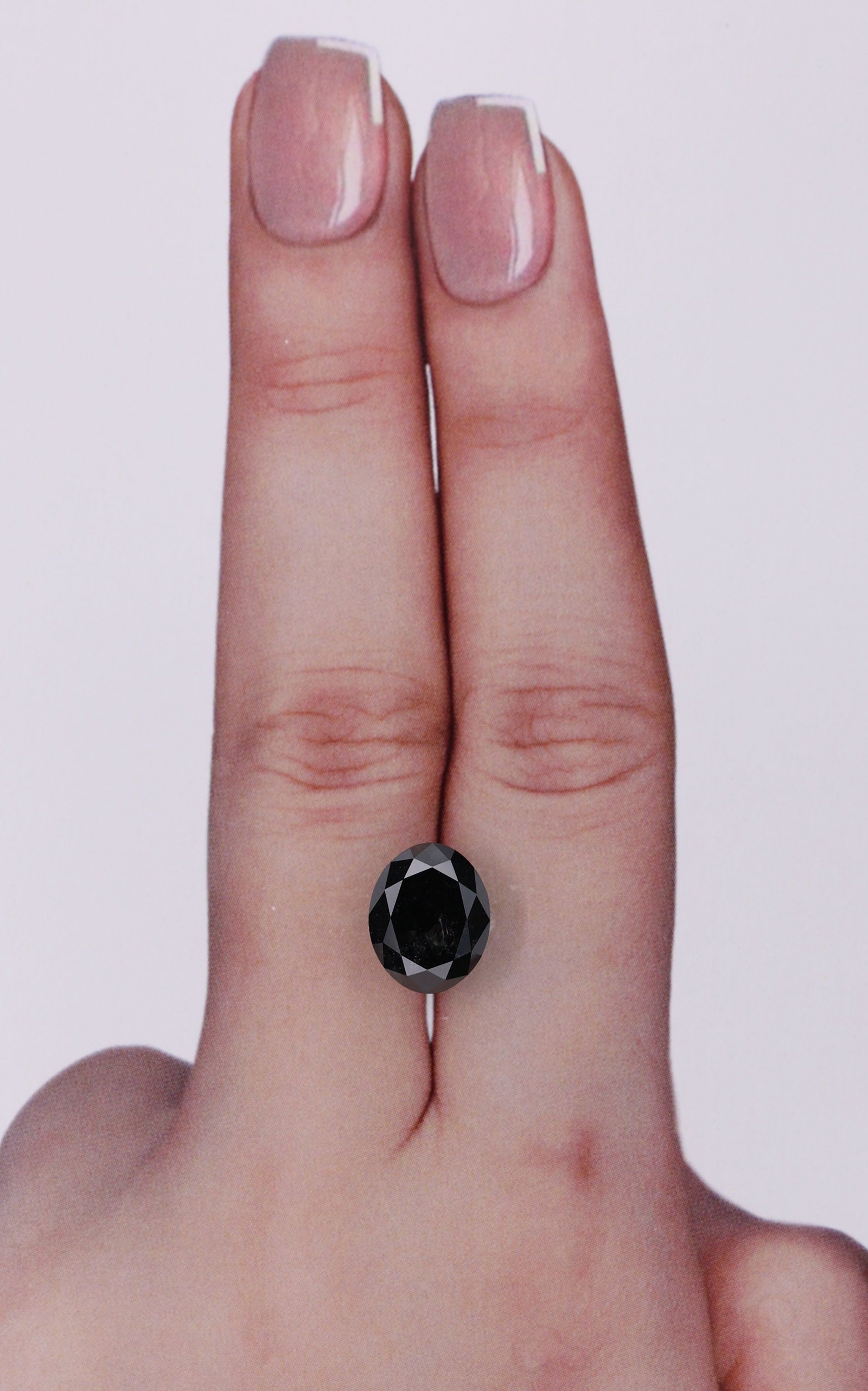 Loose Diamond - OVAL 3.41ct Black: Loose Diamond - OVAL 3.41ct Black Source: Natural Shape: OVAL Carats: 3.41 Color: Black Certification: IGI Video: