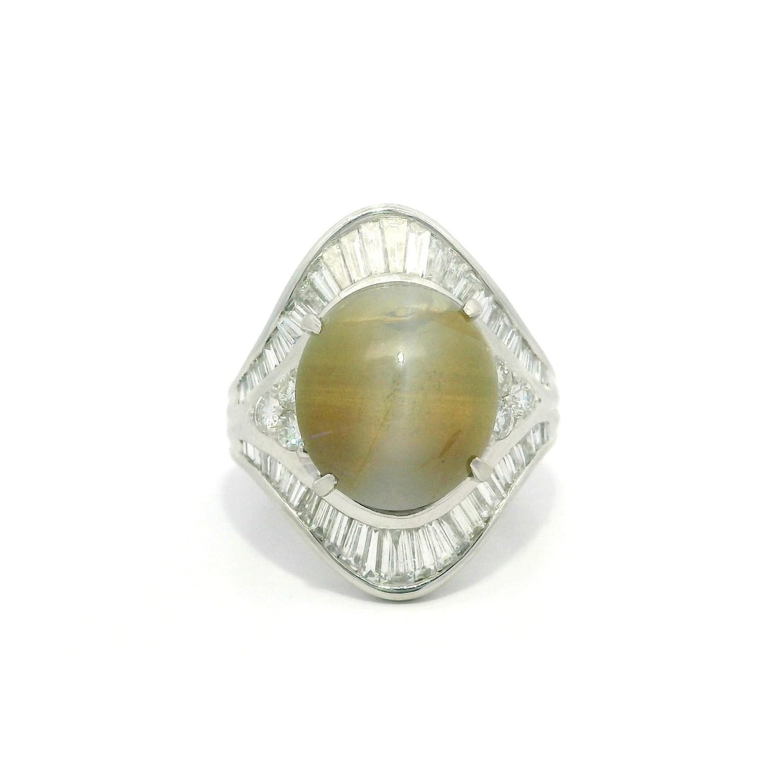 Platinum GIA Certified 10.32ctw Cat's Eye & Diamond Cocktail Ring: Platinum GIA Certified 10.32ctw Cat's Eye & Diamond Cocktail Ring This stunning cocktail ring features a natural cabochon cat's eye gemstone, elegantly set in solid platinum. The centerpiece is an 8.8