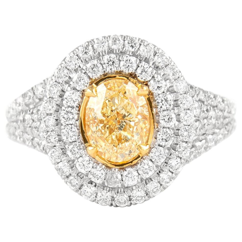 2.10ct Fancy Intense Yellow Diamond Ring 18k Gold EGL Certified: 2.10ct Fancy Intense Yellow Diamond Ring 18k Gold EGL Certified This stunning 2.10ctt Fancy Intense Yellow VS2 Oval Diamond Ring is crafted from 18k two-tone gold, combining both white and yellow gold