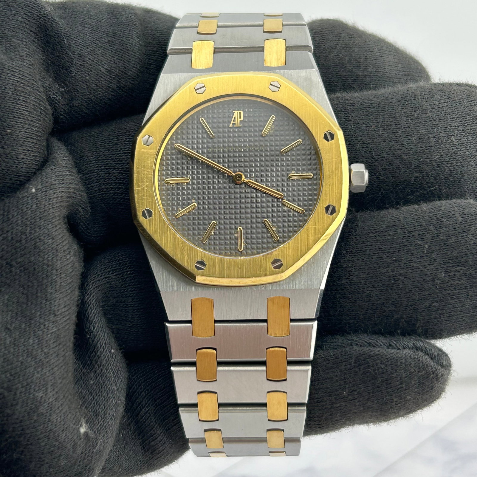 Audemars Piguet Royal Oak Unisex Watch Ref. 56143SA Grey Dial 2-Tone Bracelet: Audemars Piguet Royal Oak Unisex Watch Ref. 56143SA Grey Dial 2-Tone Bracelet Audemars Piguet Royal Oak watch with a grey dial and gold markers, presented on a 2-tone bracelet. The watch is identified