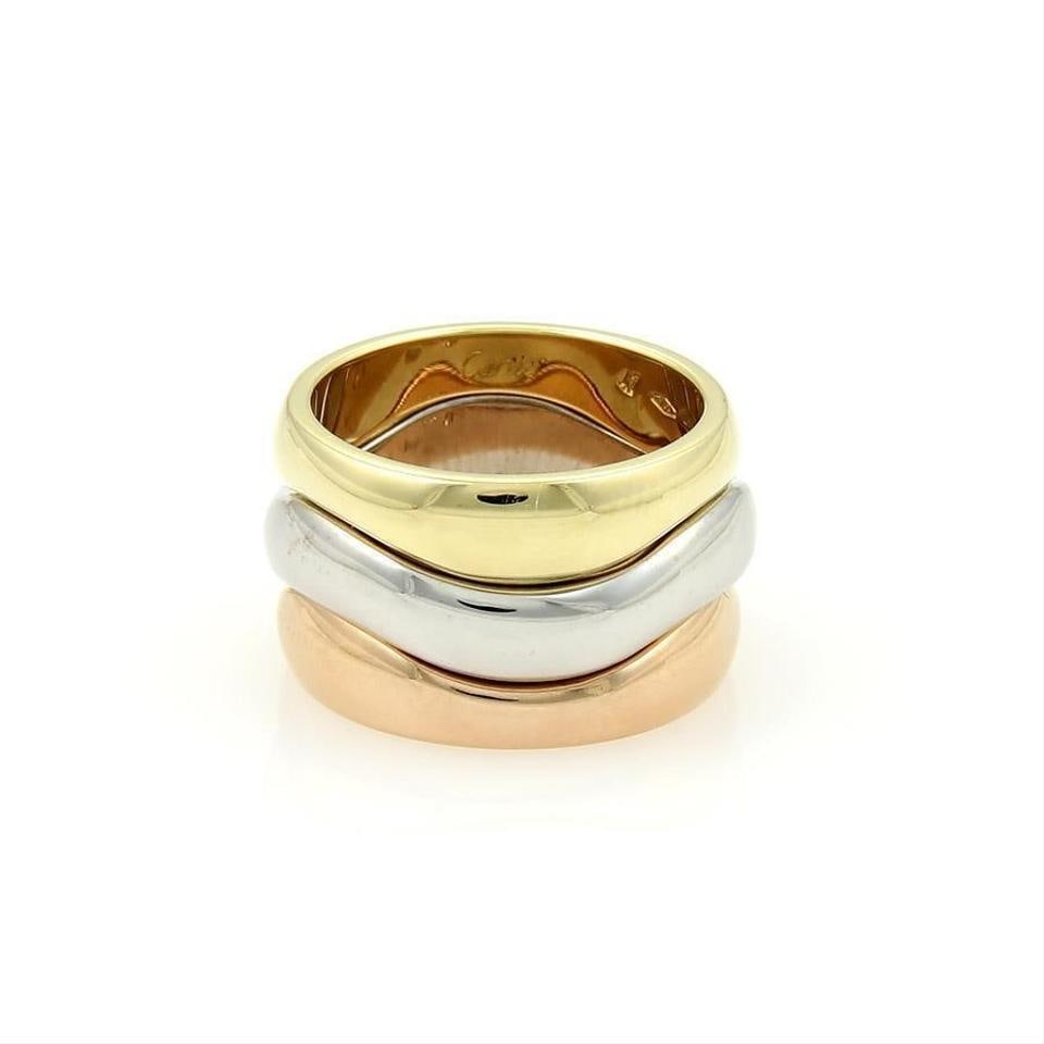 Cartier Triple Wave Puzzle Stack Ring Set 18k Tricolor Gold Size 47: Cartier Triple Wave Puzzle Stack Ring Set 18k Tricolor Gold Size 47 Authentic Cartier tricolor puzzle stack ring set composed of three interlocking wave bands in 18k yellow, white, and pink gold. Each