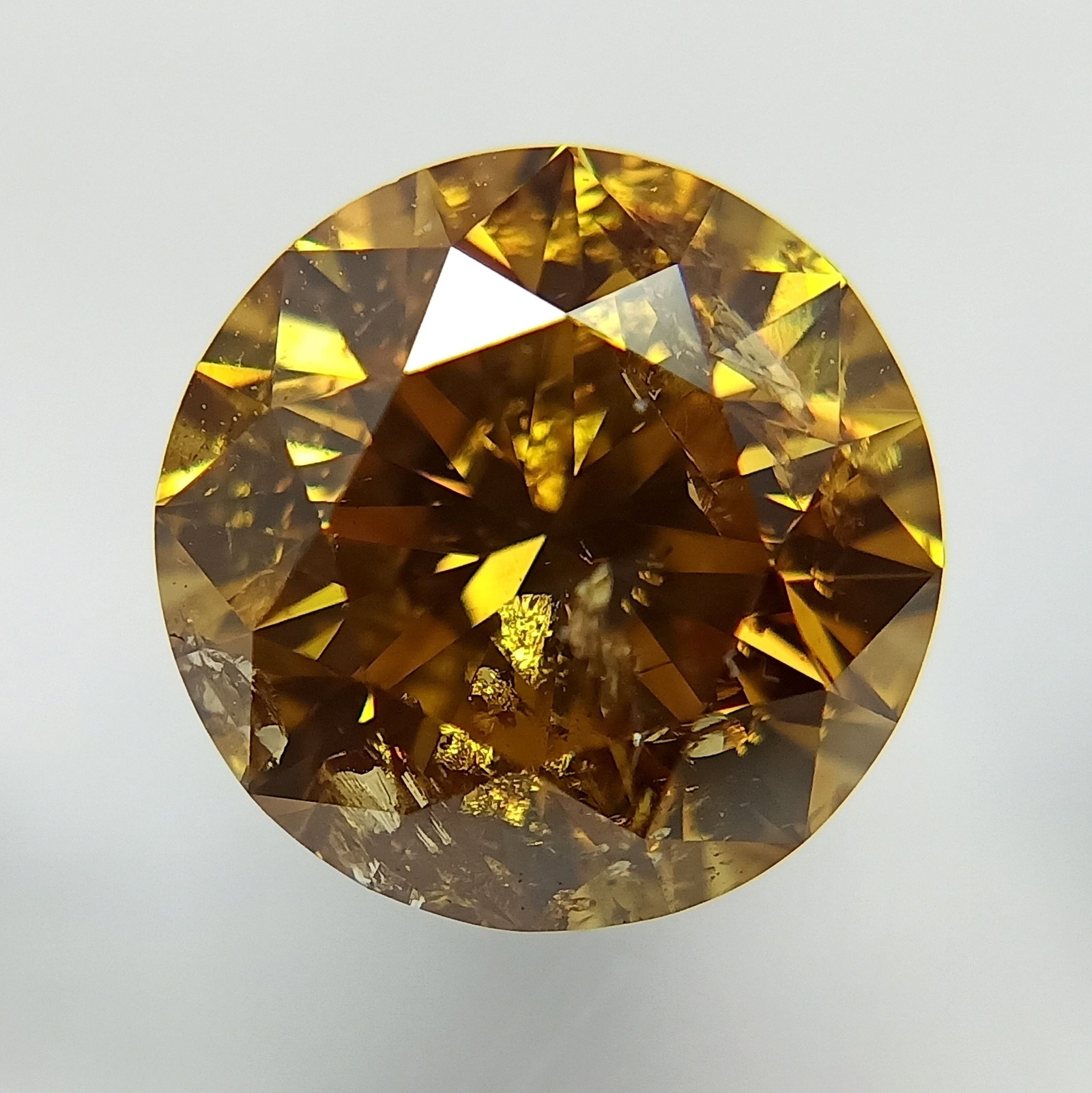 Loose Diamond - ROUND 1.74ct Fancy Deep Brownish Orangey Yellow: Loose Diamond - ROUND 1.74ct Fancy Deep Brownish Orangey Yellow Source: Natural Shape: ROUND Carats: 1.74 Color: Fancy Deep Brownish Orangey Yellow Certification: GIA The Diamond Depot Guarantee: All 