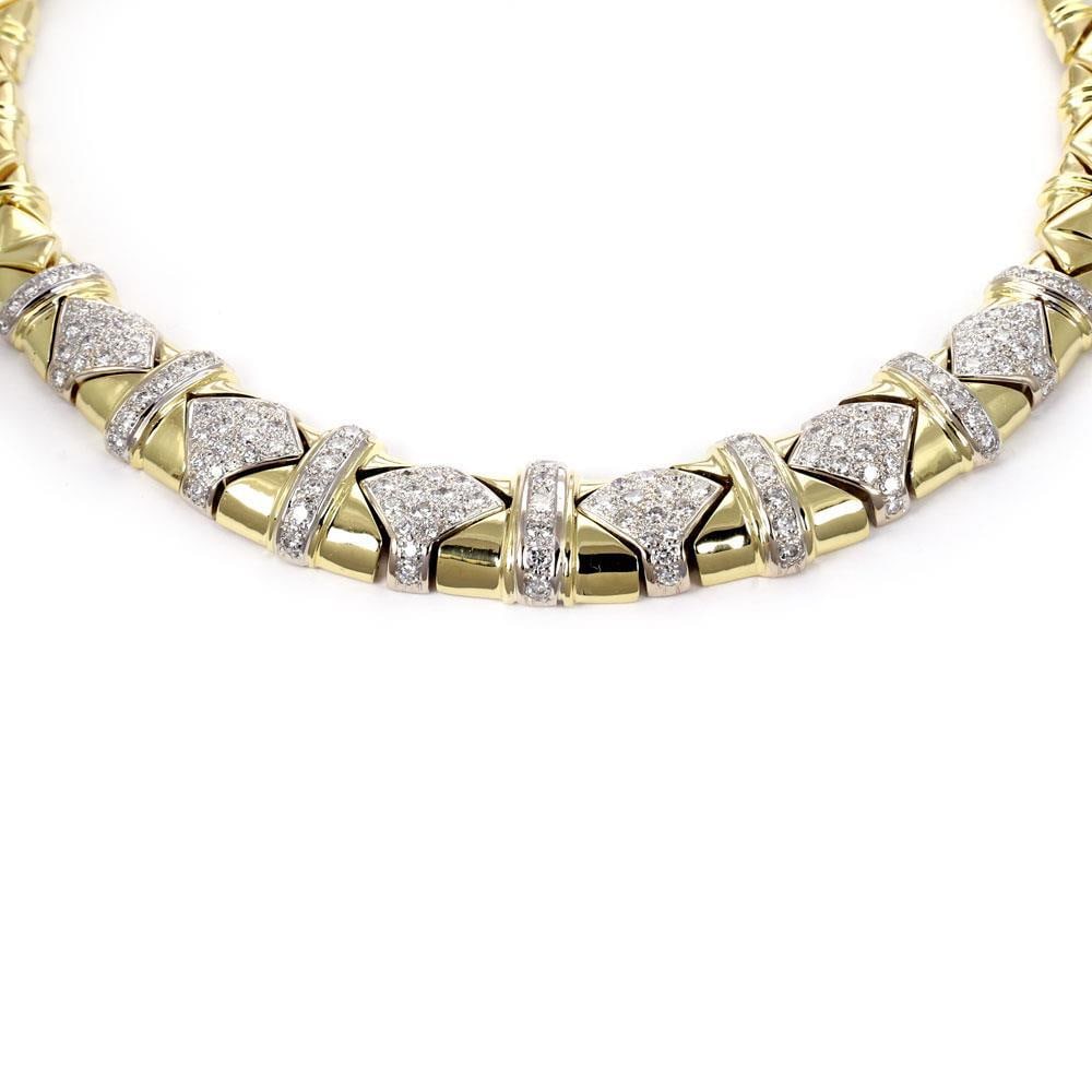 18k Yellow White Gold Geometric Link Collar Necklace with 5.5ct Diamonds: 18k Yellow White Gold Geometric Link Collar Necklace with 5.5ct Diamonds Graduated geometric link collar necklace crafted in 18k yellow and white gold with a polished finish. The front section is acce