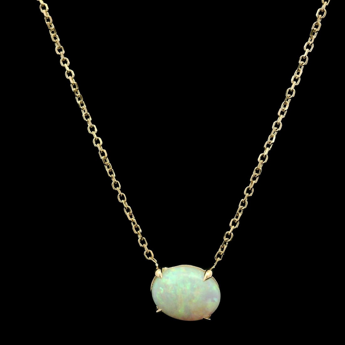 14k Yellow Gold 0.90ct Natural Opal Solitaire Pendant Necklace: 14k Yellow Gold 0.90ct Natural Opal Solitaire Pendant Necklace This exquisite necklace features a stunning 0.90ct natural opal solitaire pendant, showcasing a beautiful oval cabochon cut. The opal is 